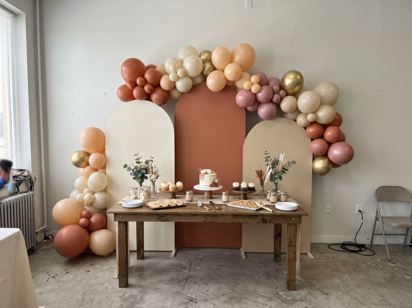 Chiara arched backdrop trio in terracotta, sand and cream with balloons