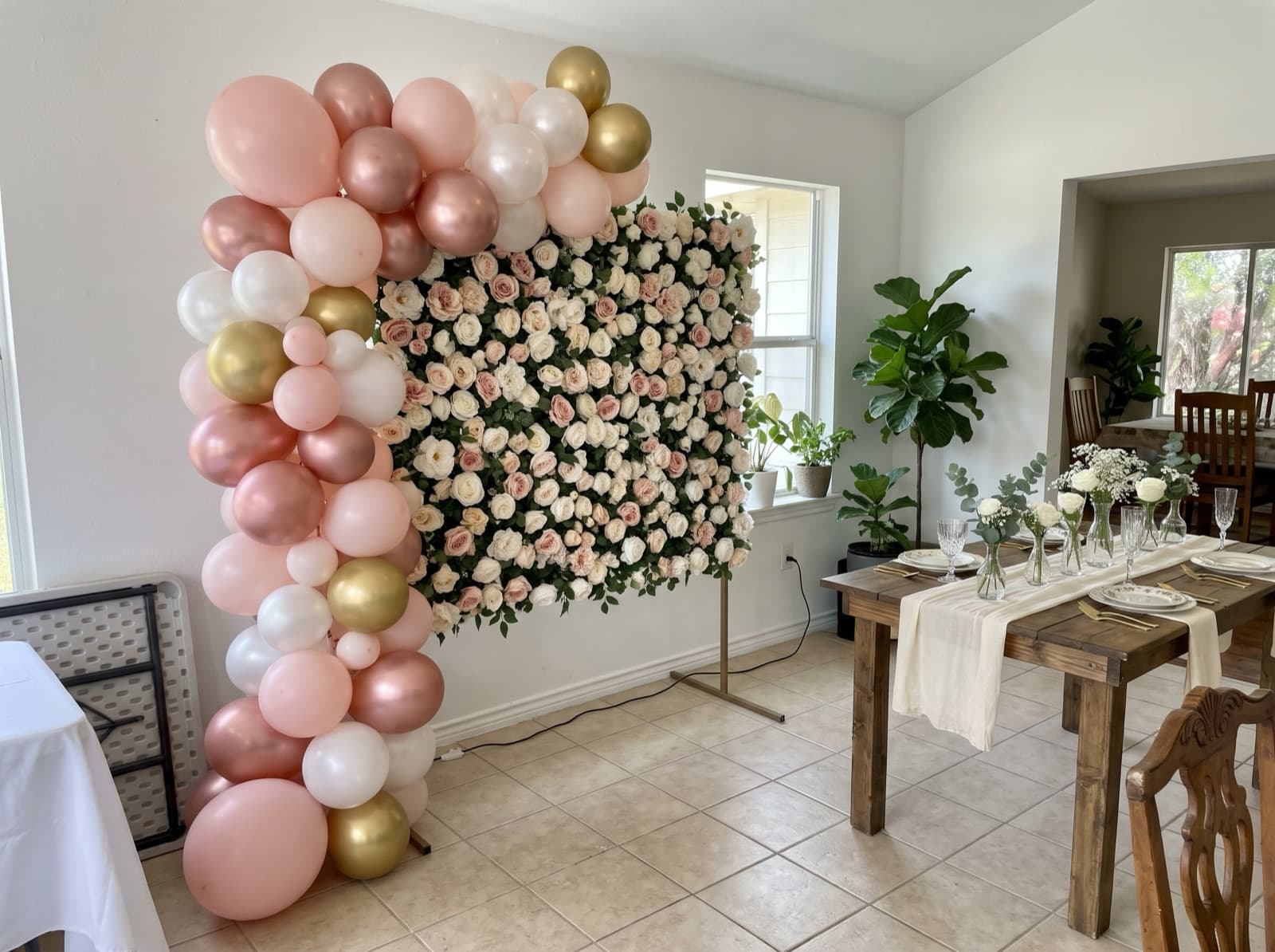 Flower wall backdrop with blush and gold balloons