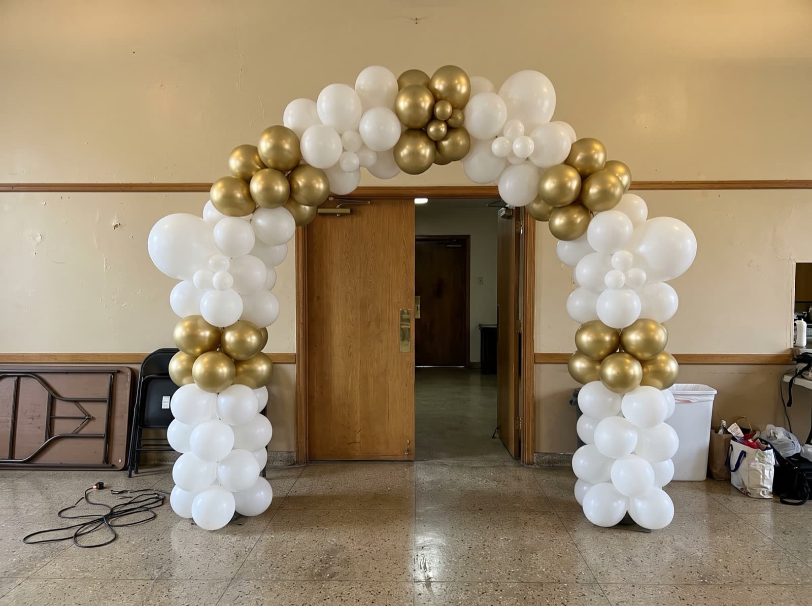 Balloon columns joined by an arch at a parish hall entrance