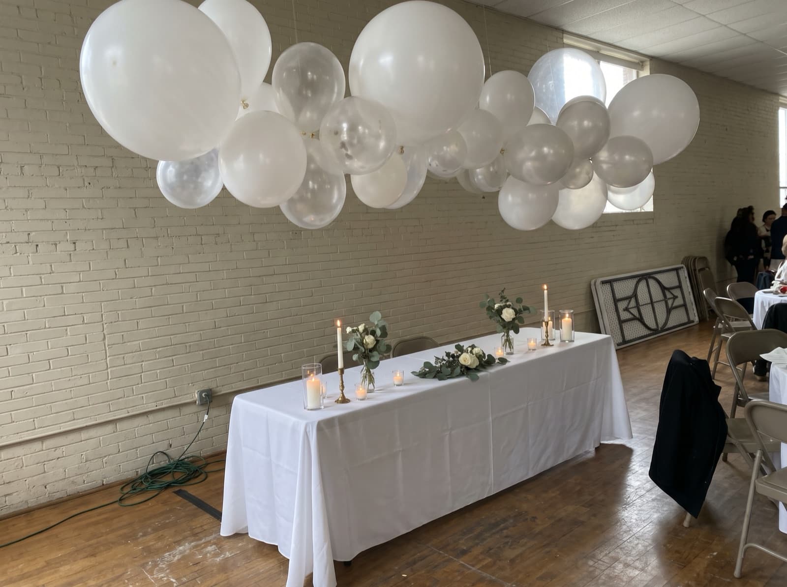 Balloon cloud over a sweetheart table