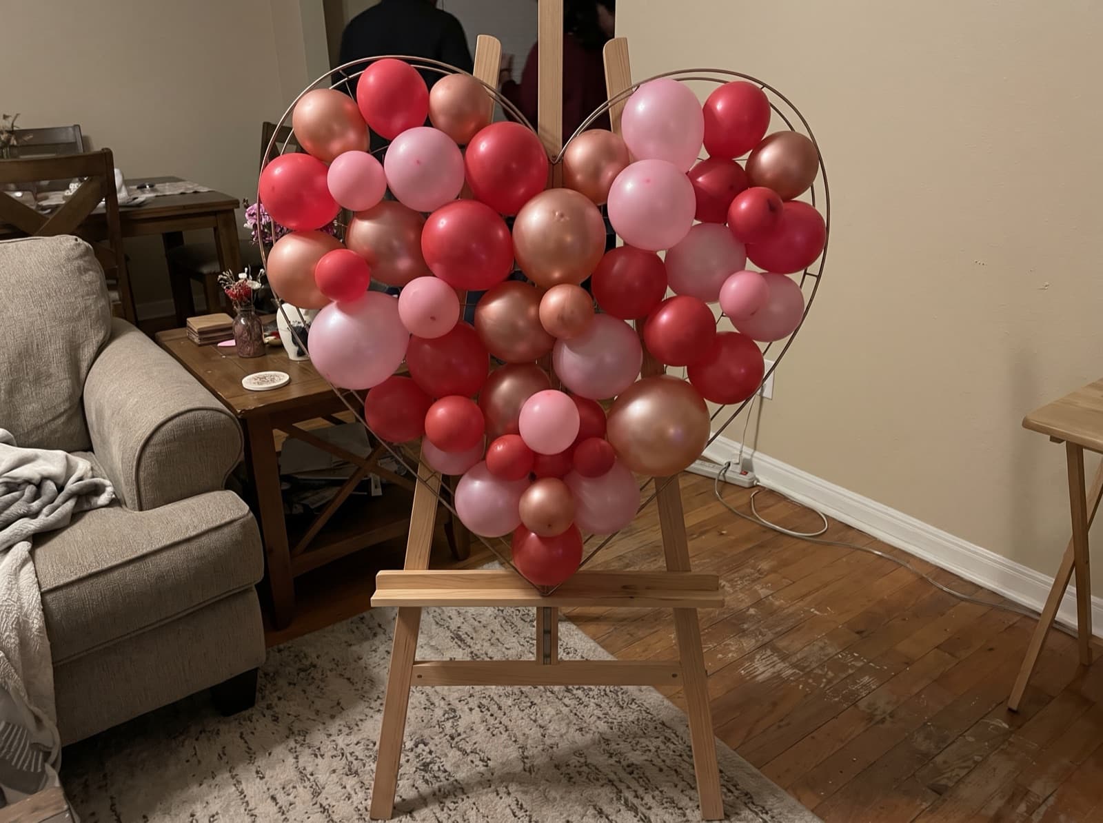 Heart-shaped balloon mosaic in red and pink
