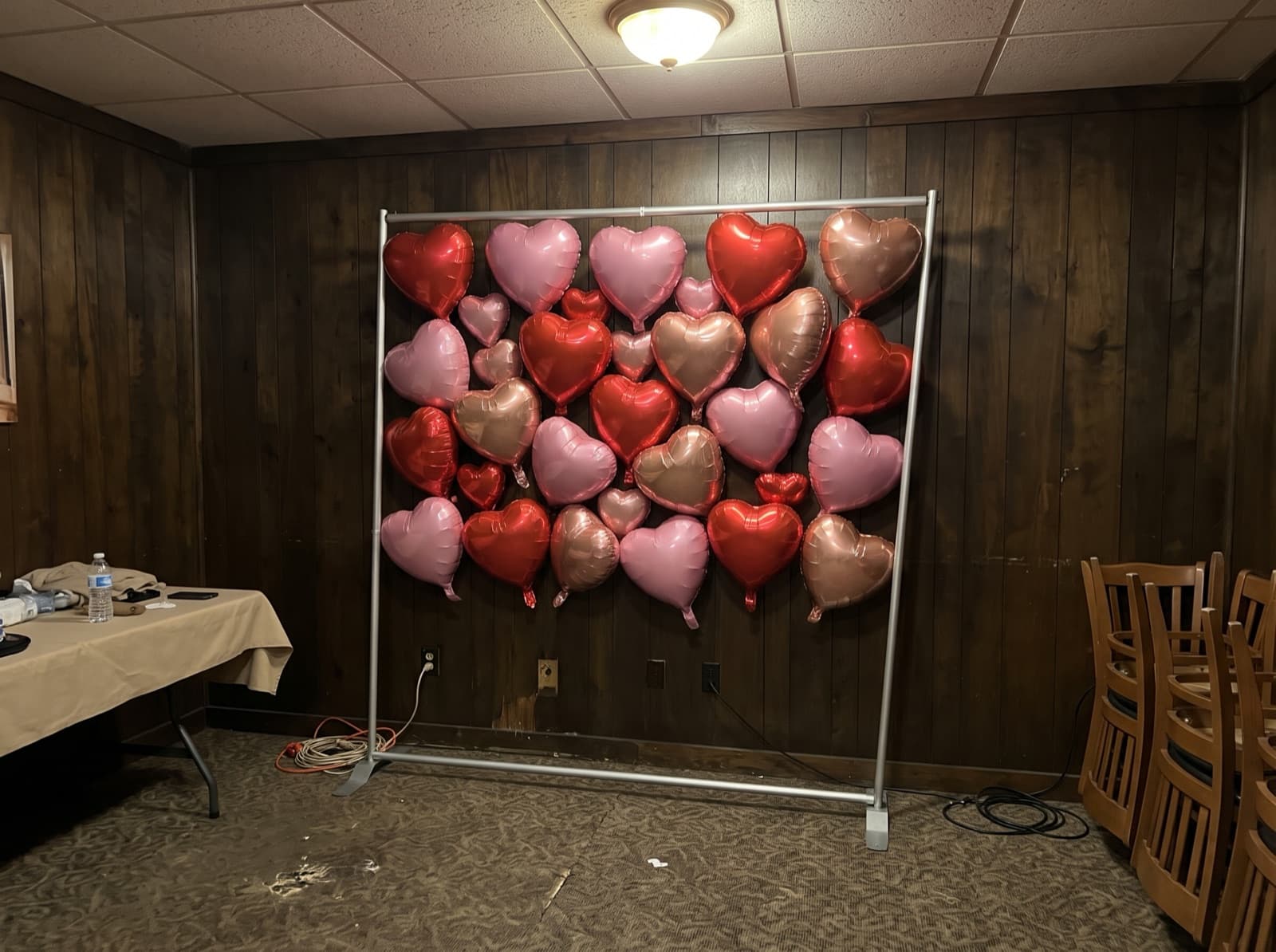 Foil heart balloon wall in red, pink and rose gold